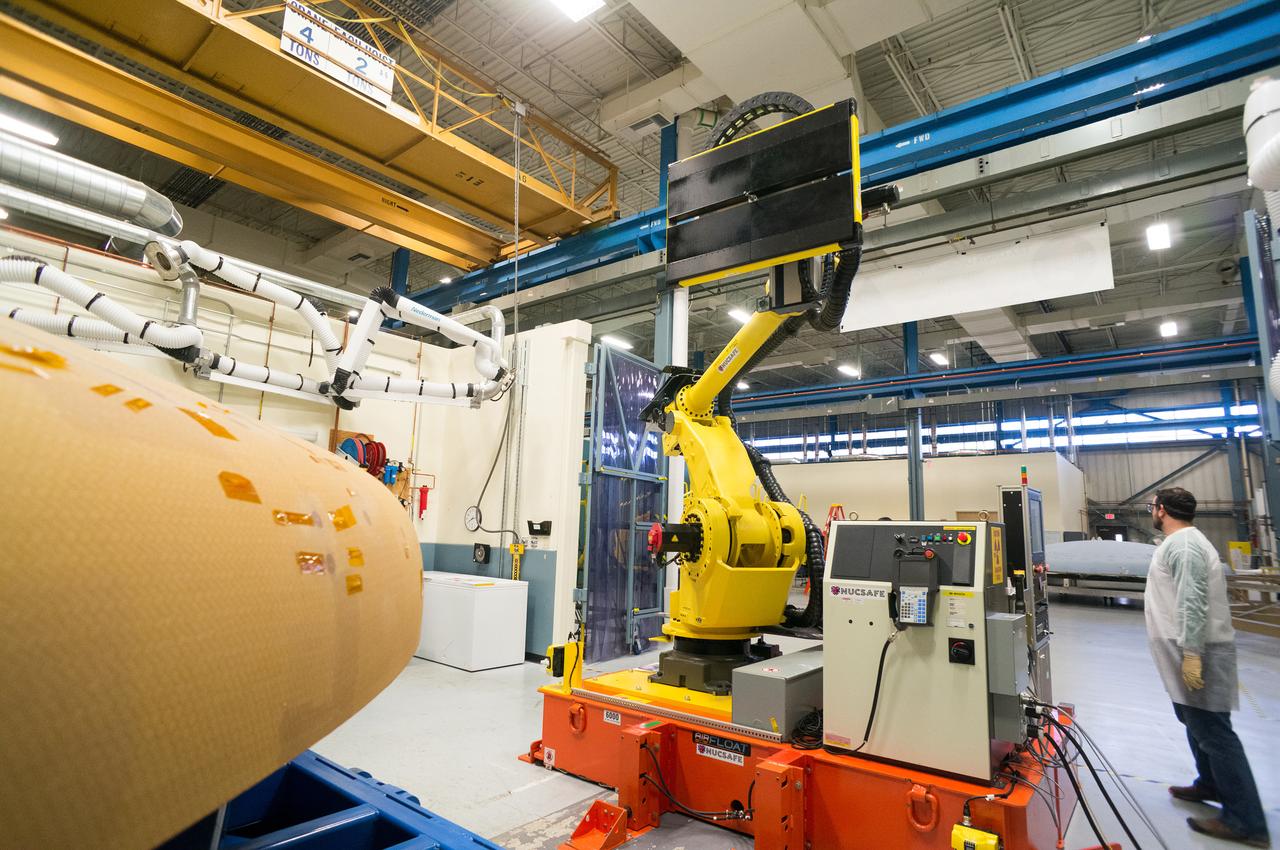 Technicians at Textron in Wimington, MA, perform X-ray testing on the Exploration Flight Test-1 (EFT-1) Orion heat shield on Nov. 23, 2013. Part of Batch image transfer from Flickr.