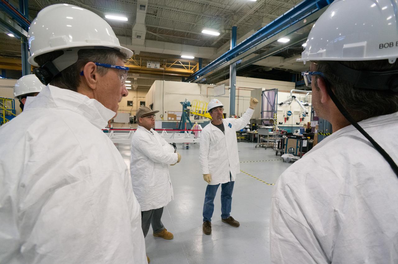 Technicians at Textron in Wimington, MA, move the Exploration Flight Test-1 (EFT-1) Orion heat shield into position for X-ray testing on Nov. 23, 2013. Part of Batch image transfer from Flickr.