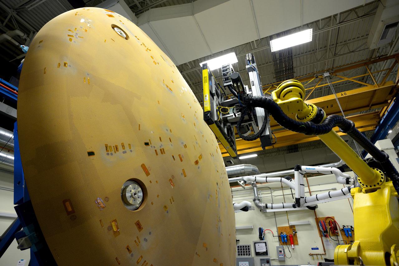 Technicians at Textron in Wimington, MA, perform X-ray testing on the Exploration Flight Test-1 (EFT-1) Orion heat shield on Nov. 23, 2013. Part of Batch image transfer from Flickr.
