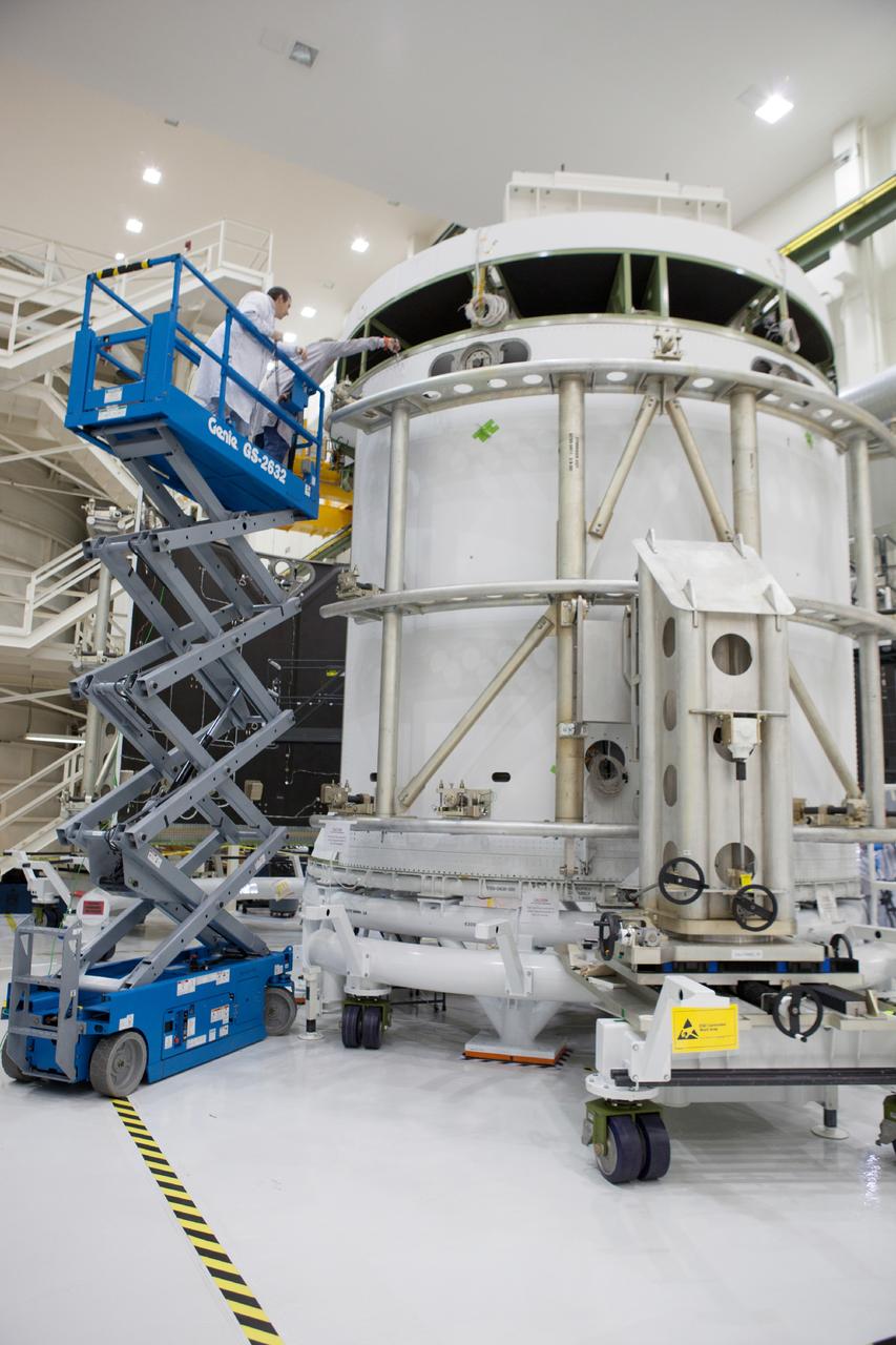 Technicians work on the Exploration Flight Test-1 (EFT-1) Orion service module in the Operations and Checkout Building (O&C) at Kennedy Space Center on Dec. 24, 2013. Part of Batch image transfer from Flickr.