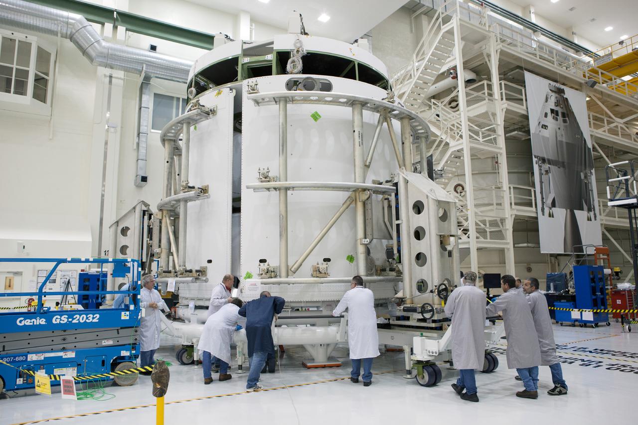 Technicians work on the Exploration Flight Test-1 (EFT-1) Orion service module in the Operations and Checkout Building (O&amp;C) at Kennedy Space Center on Dec. 24, 2013. Part of Batch image transfer from Flickr.