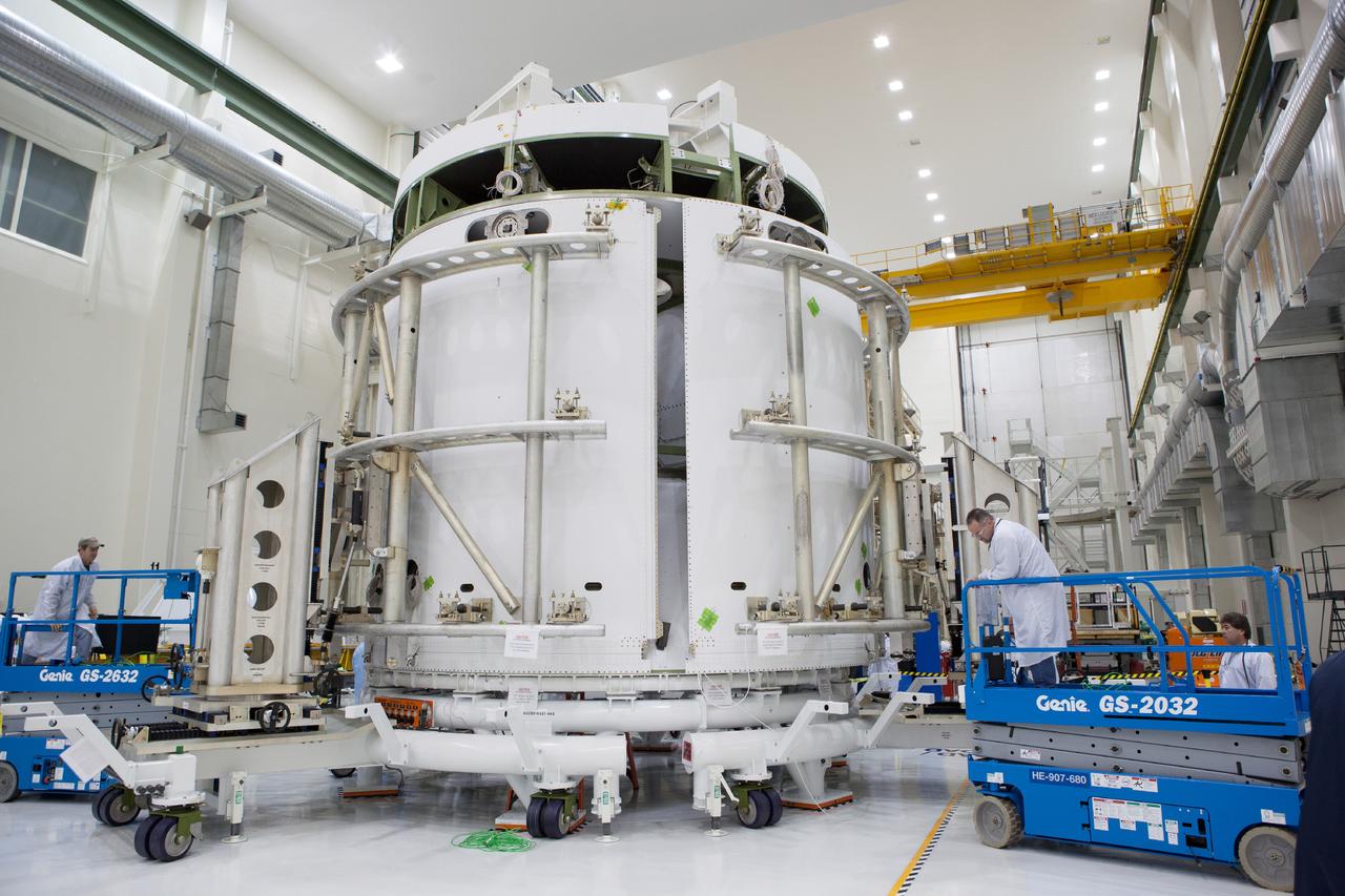 Technicians work on the Exploration Flight Test-1 (EFT-1) Orion service module in the Operations and Checkout Building (O&amp;C) at Kennedy Space Center on Dec. 24, 2013. Part of Batch image transfer from Flickr.