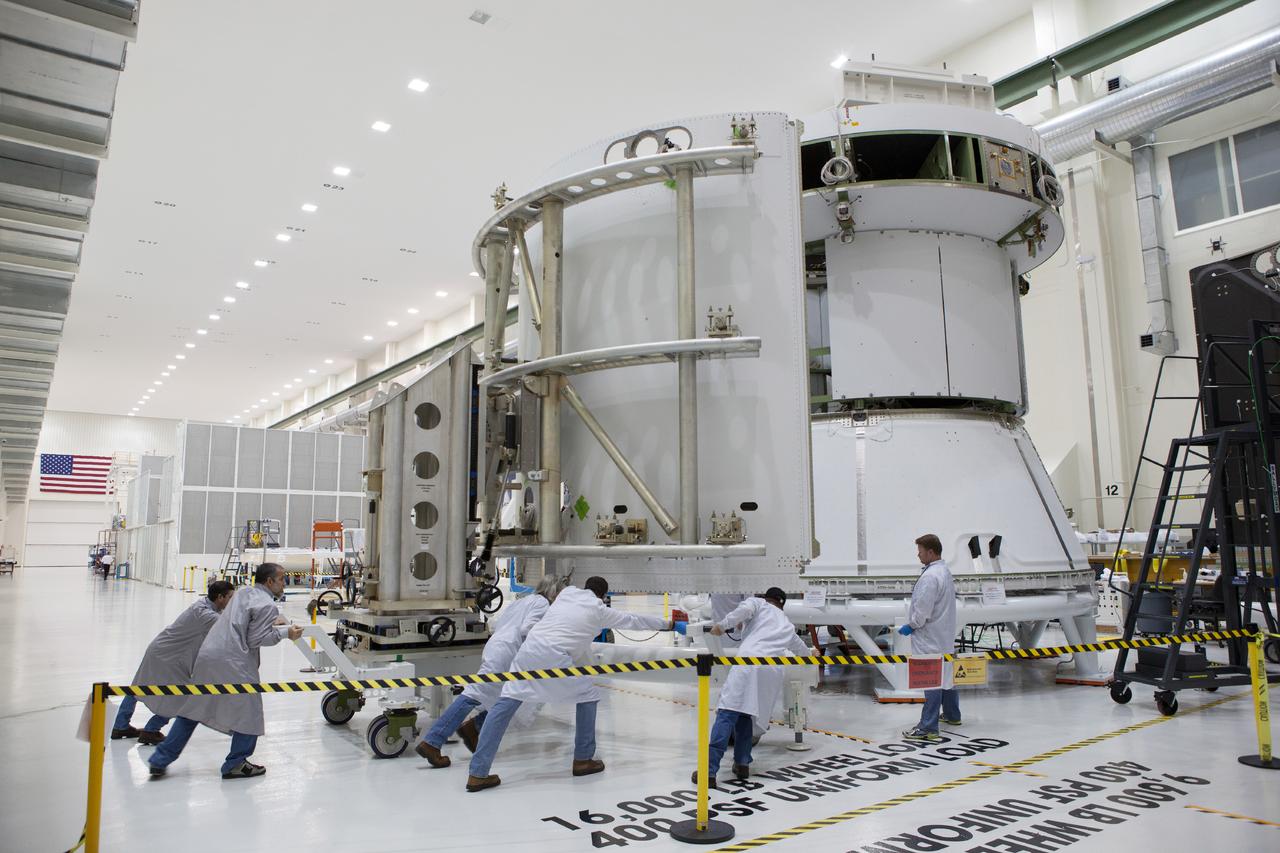 Technicians work on the Exploration Flight Test-1 (EFT-1) Orion service module in the Operations and Checkout Building (O&amp;C) at Kennedy Space Center on Dec. 24, 2013. Part of Batch image transfer from Flickr.