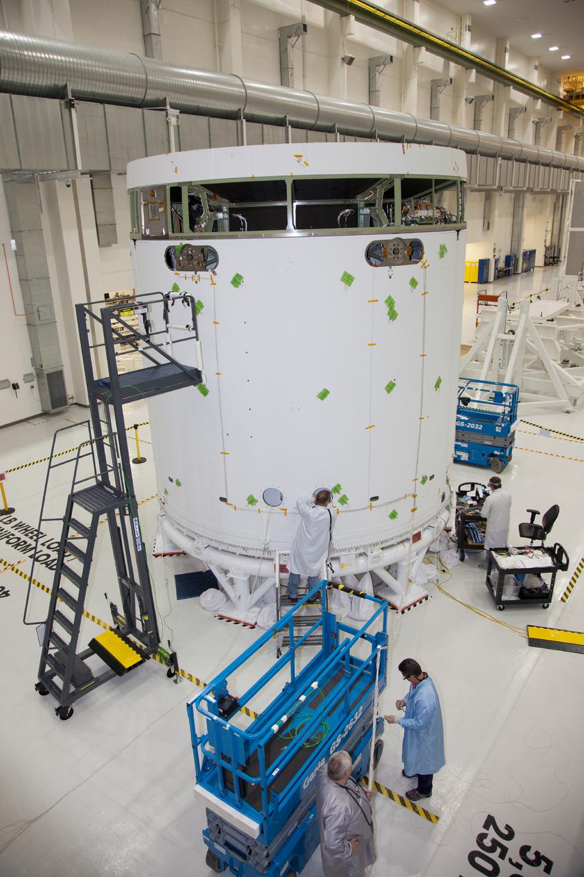 The spacecraft adapter jettison fairing panels are installed on the Exploration Flight Test-1 (EFT-1) Orion service module in the Operations and Checkout (O&amp;C) Building at Kennedy Space Center on Jan. 14 , 2014. Part of Batch image transfer from Flickr.