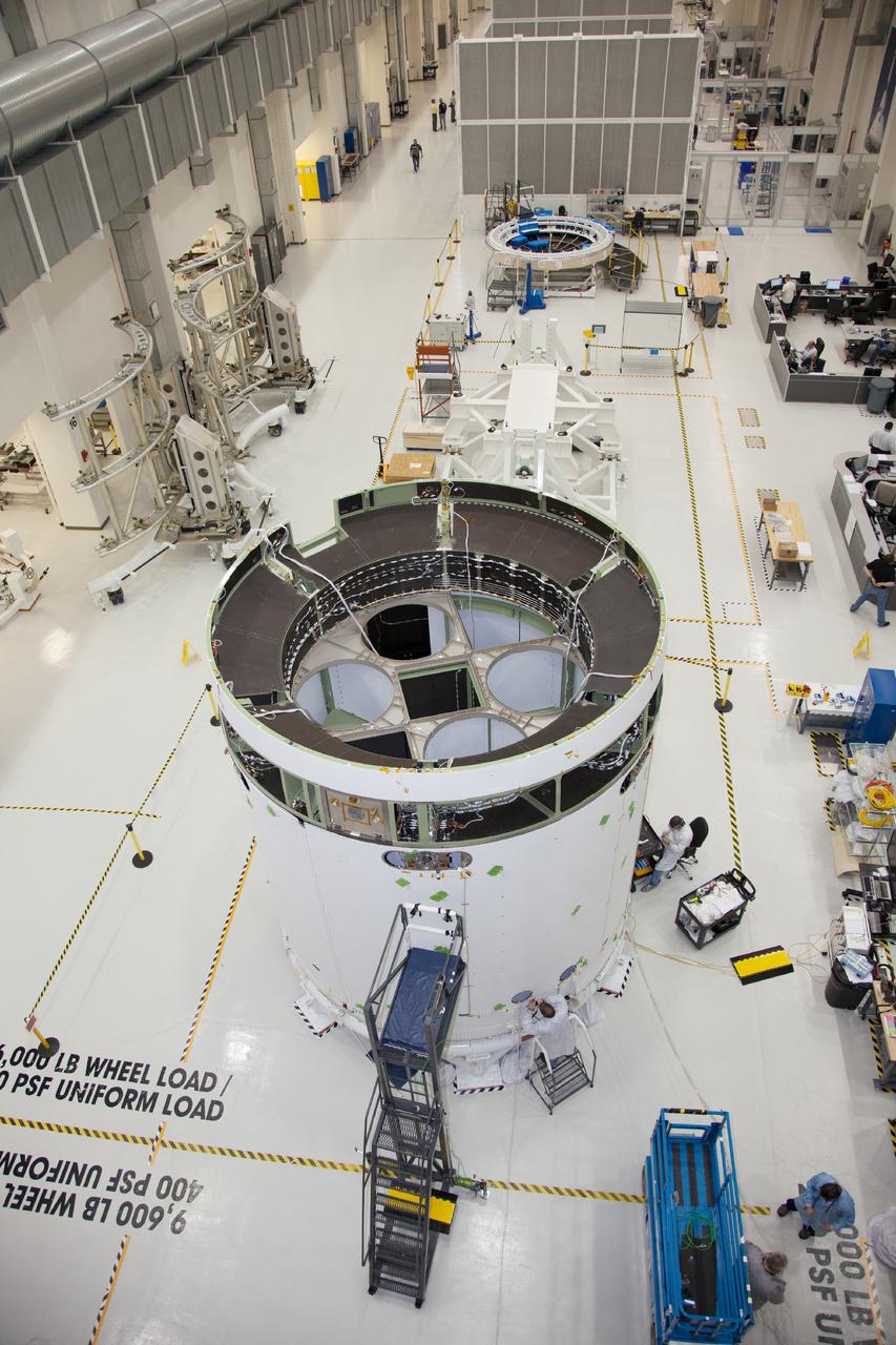 The spacecraft adapter jettison fairing panels are installed on the Exploration Flight Test-1 (EFT-1) Orion service module in the Operations and Checkout (O&amp;C) Building at Kennedy Space Center on Jan. 14 , 2014. Part of Batch image transfer from Flickr.