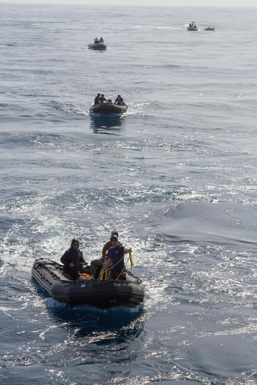 NASA and the U.S. Navy conduct a test on Feb. 20, 2014 in the Pacific Ocean, about 100 miles off the coast of San Diego, California, to prepare for the recovery of the Orion crew module, forward bay cover and parachutes on its return from a deep space mission. The underway recovery test will allow the teams to demonstrate and evaluate the recovery processes, procedures, hardware and personnel in open waters. Part of Batch image transfer from Flickr.
