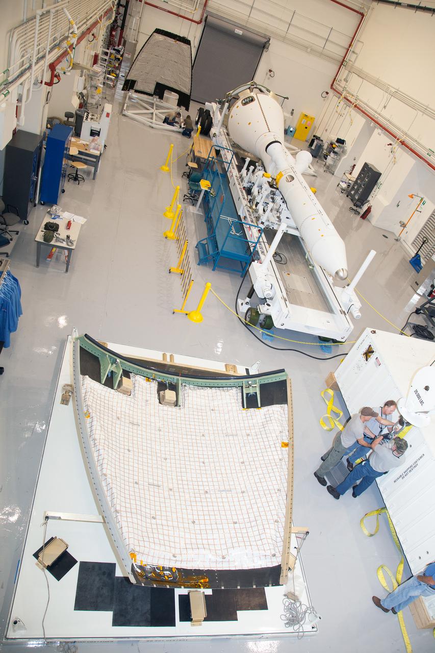 The launch abort system ogive panels are prepared for installation onto the Orion Exploration Flight Test-1 (EFT-1) launch abort system in the Launch Abort System Facility (LASF) at Kennedy Space Center on April 16, 2014. Part of Batch image transfer from Flickr.