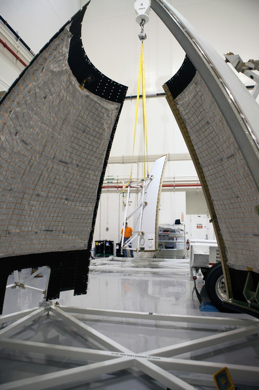 The launch abort system ogive panels are prepared for installation onto the Orion Exploration Flight Test-1 (EFT-1) launch abort system in the Launch Abort System Facility (LASF) at Kennedy Space Center on April 16, 2014. Part of Batch image transfer from Flickr.