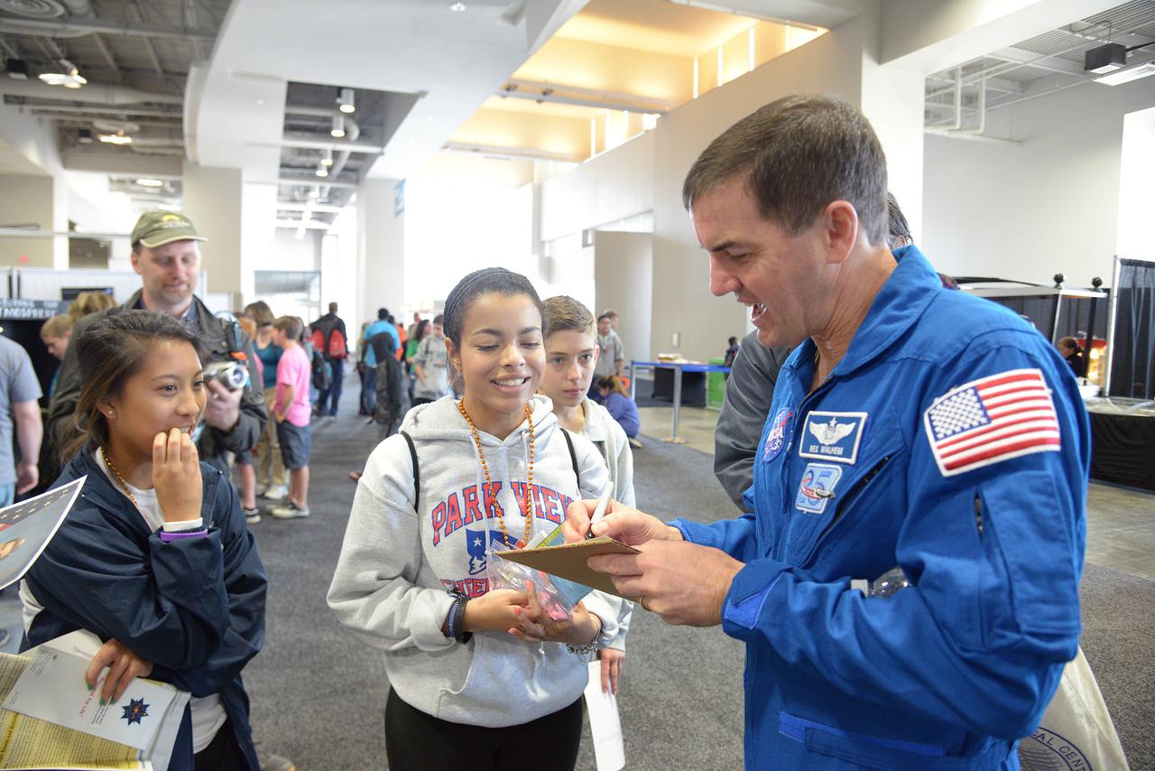 The winner of the high school portion of the Exploration Design Challenge is announced at the USA Science and Engineering Festival in Washington on April 25, 2014. Astronaut Rex Walheim signs autographs for students. Part of Batch image transfer from Flickr.