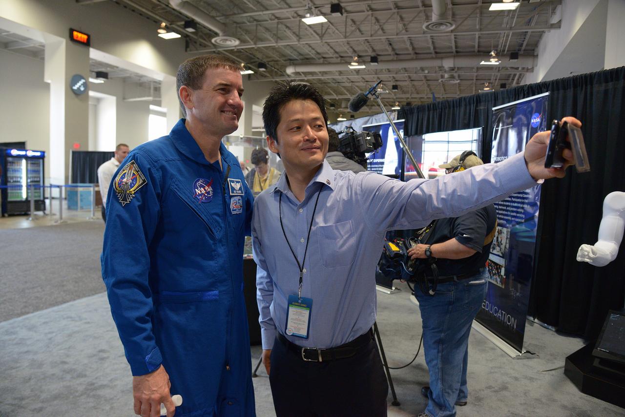 The winner of the high school portion of the Exploration Design Challenge is announced at the USA Science and Engineering Festival in Washington on April 25, 2014. Astronaut Rex Walheim is photographed with event participant. Part of Batch image transfer from Flickr.