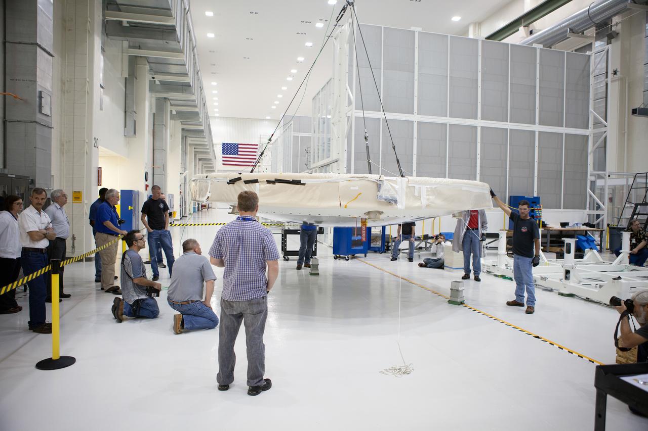 The Orion Exploration Flight Test-1 (EFT-1) crew module is prepared for mating with the heat shield in the Operations and Checkout (O&amp;C) Building at Kennedy Space Center on May 9, 2014. Part of Batch image transfer from Flickr.