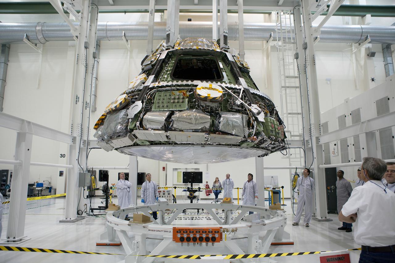 The Orion Exploration Flight Test-1 (EFT-1) crew module is prepared for mating with the heat shield in the Operations and Checkout (O&amp;C) Building at Kennedy Space Center on May 9, 2014. Part of Batch image transfer from Flickr.