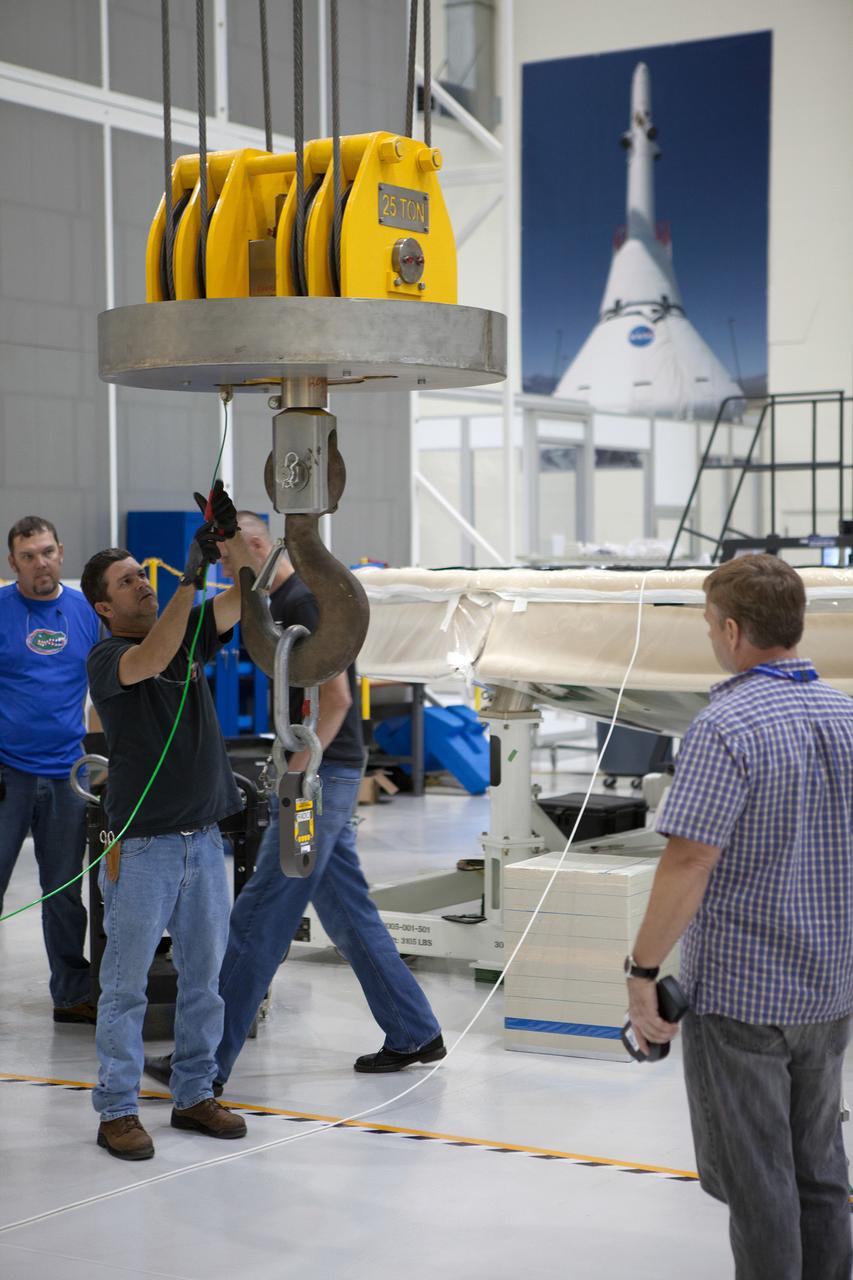 The Orion Exploration Flight Test-1 (EFT-1) crew module is prepared for mating with the heat shield in the Operations and Checkout (O&amp;C) Building at Kennedy Space Center on May 9, 2014. Part of Batch image transfer from Flickr.