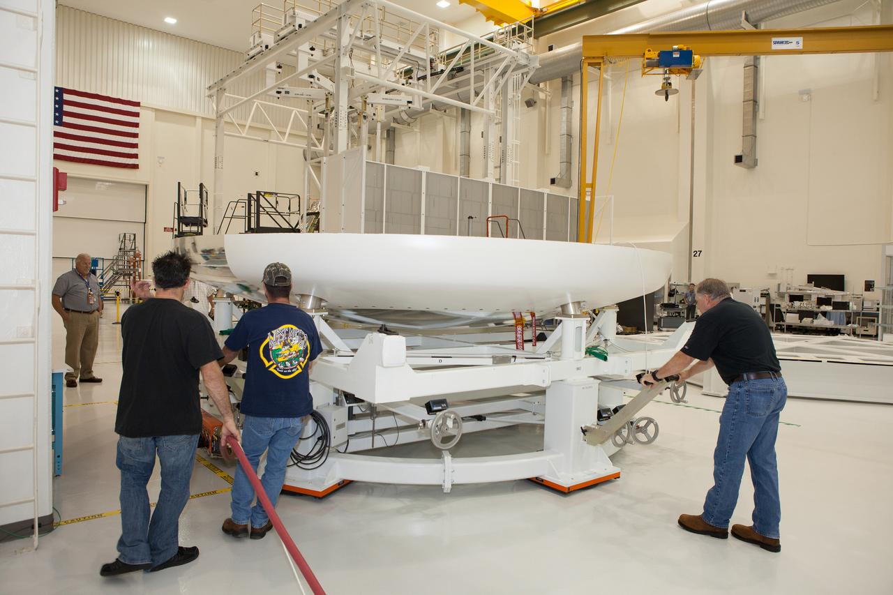 The Orion Exploration Flight Test-1 (EFT-1) crew module is prepared for mating with the heat shield in the Operations and Checkout (O&amp;C) Building at Kennedy Space Center on May 14, 2014. Part of Batch image transfer from Flickr.