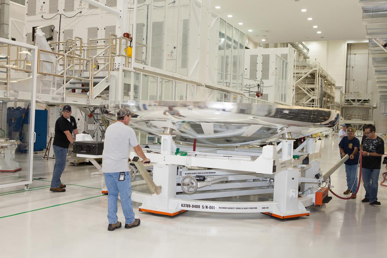 The Orion Exploration Flight Test-1 (EFT-1) crew module is prepared for mating with the heat shield in the Operations and Checkout (O&amp;C) Building at Kennedy Space Center on May 14, 2014. Part of Batch image transfer from Flickr.