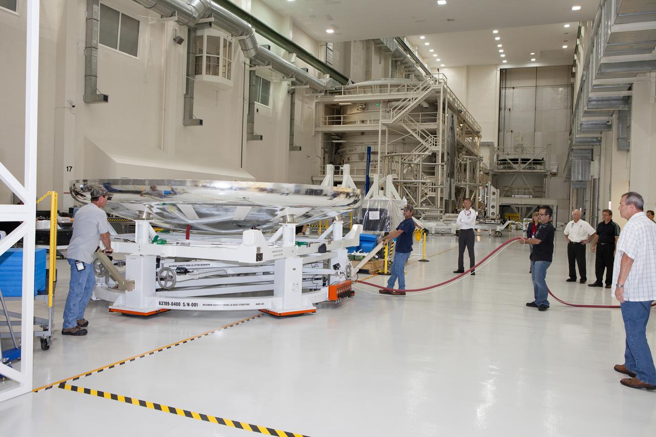 The Orion Exploration Flight Test-1 (EFT-1) crew module is prepared for mating with the heat shield in the Operations and Checkout (O&amp;C) Building at Kennedy Space Center on May 14, 2014. Part of Batch image transfer from Flickr.