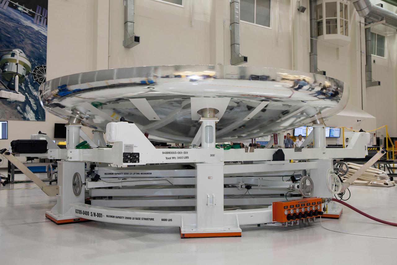 The Orion Exploration Flight Test-1 (EFT-1) crew module is prepared for mating with the heat shield in the Operations and Checkout (O&amp;C) Building at Kennedy Space Center on May 14, 2014. Part of Batch image transfer from Flickr.