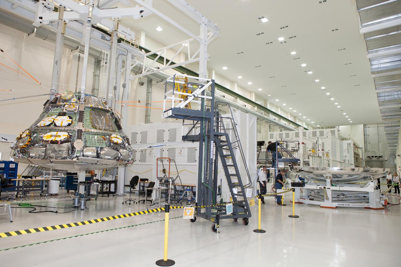 The Orion Exploration Flight Test-1 (EFT-1) crew module is prepared for mating with the heat shield in the Operations and Checkout (O&amp;C) Building at Kennedy Space Center on May 14, 2014. Part of Batch image transfer from Flickr.