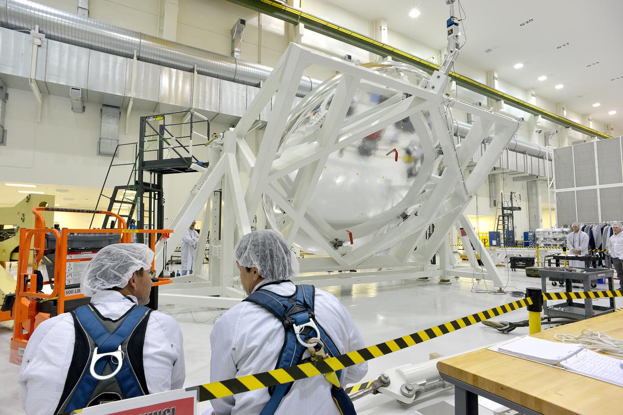 An Orion weight and center of gravity test with the Exploration Flight Test-1 (EFT-1) crew module takes place at the Operations and Checkout (O&C) Building at Kennedy Space Center on June 8, 2014. Part of Batch image transfer from Flickr.