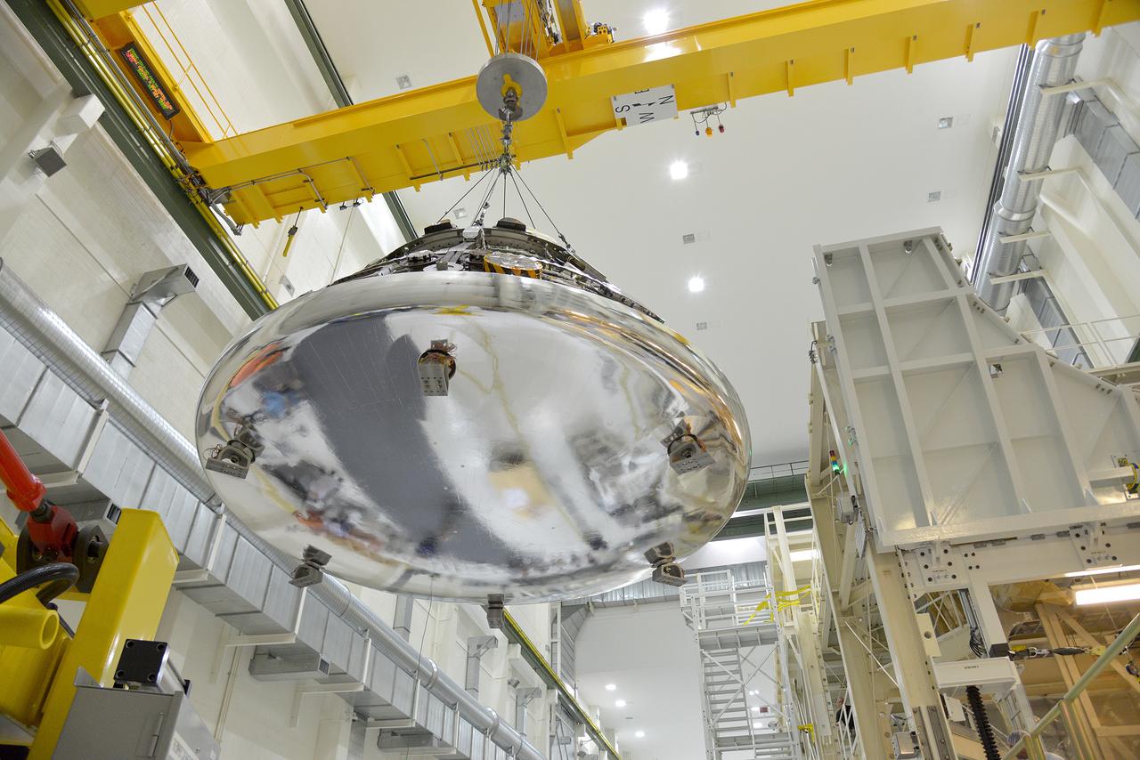 View of the Orion Exploration Flight Test-1 (EFT-1) crew module and service module mating operations in Operations and Checkout (O&C) Building at Kennedy Space Center on June 9, 2014. Part of Batch image transfer from Flickr.