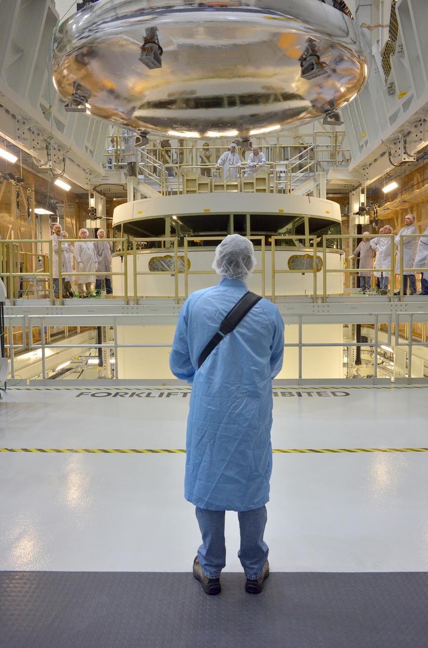 The Orion Exploration Flight Test-1 (EFT-1) crew module is moved and mated with the service module at the Operations and Checkout (O&C) Building at Kennedy Space Center on June 9, 2014. Part of Batch image transfer from Flickr.