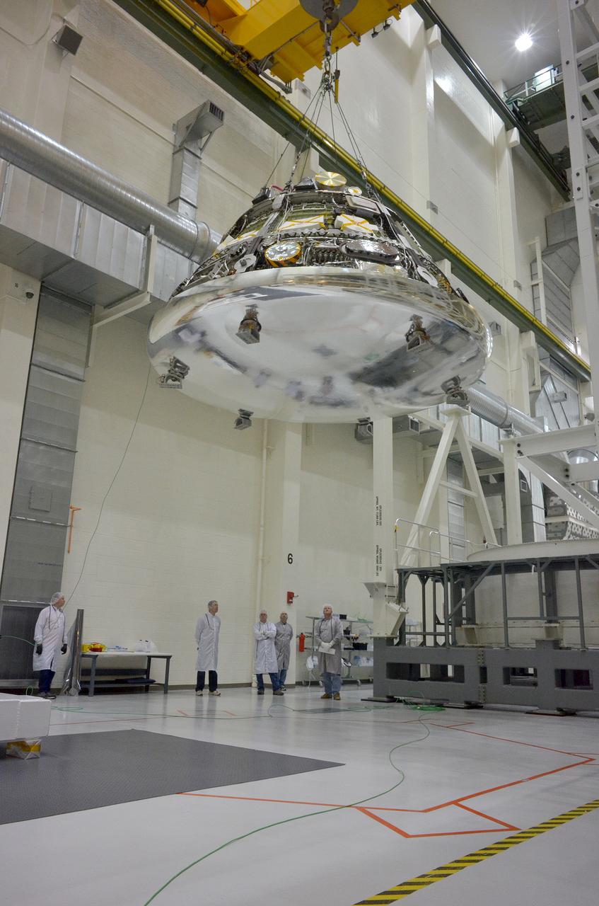 The Orion Exploration Flight Test-1 (EFT-1) crew module is moved and mated with the service module at the Operations and Checkout (O&amp;C) Building at Kennedy Space Center on June 9, 2014. Part of Batch image transfer from Flickr.