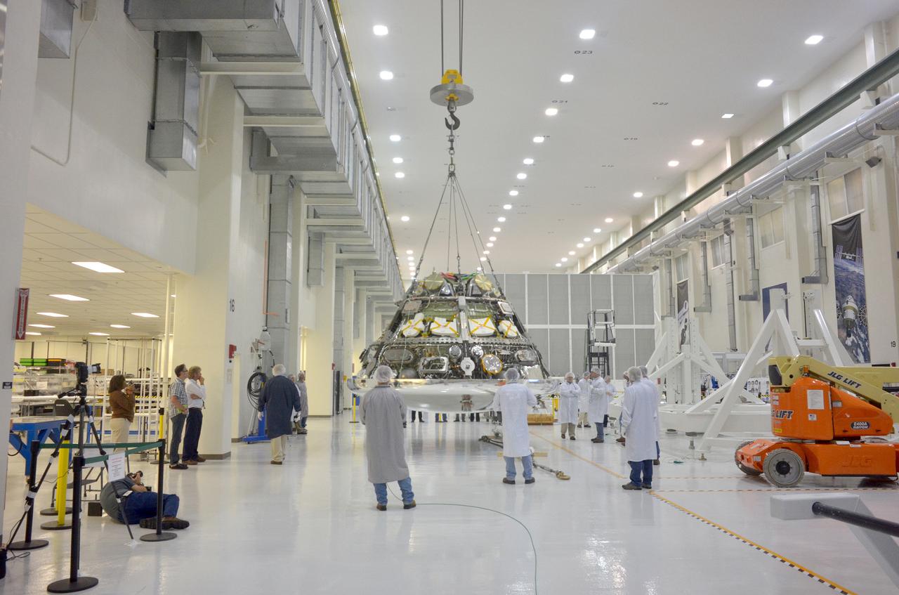 Astronaut Anna Fisher observes Orion Exploration Flight Test-1 (EFT-1) crew module and service module mating operations in Operations and Checkout (O&amp;C) Building at Kennedy Space Center on June 9, 2014. Part of Batch image transfer from Flickr.