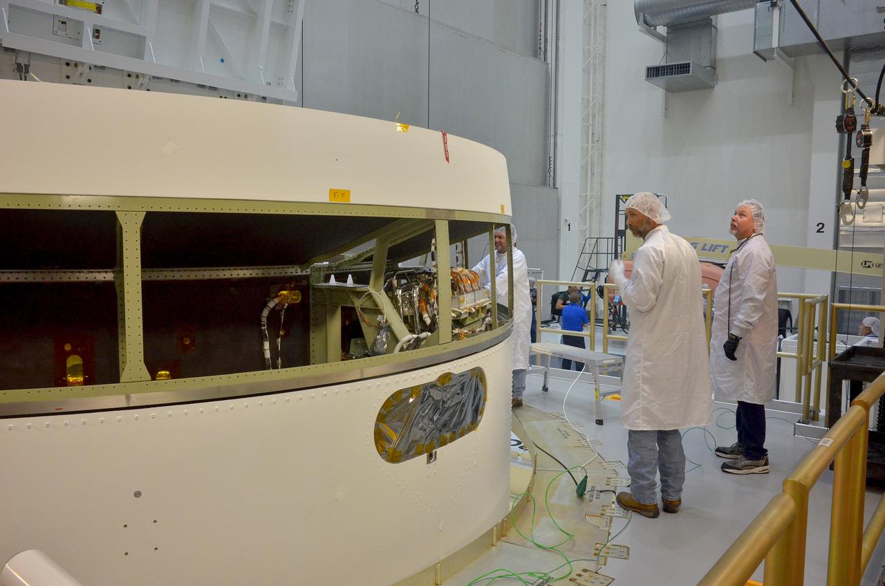  The Orion Exploration Flight Test-1 (EFT-1) crew module is moved and mated with the service module at the Operations and Checkout (O&amp;C) Building at Kennedy Space Center on June 9, 2014. Part of Batch image transfer from Flickr.