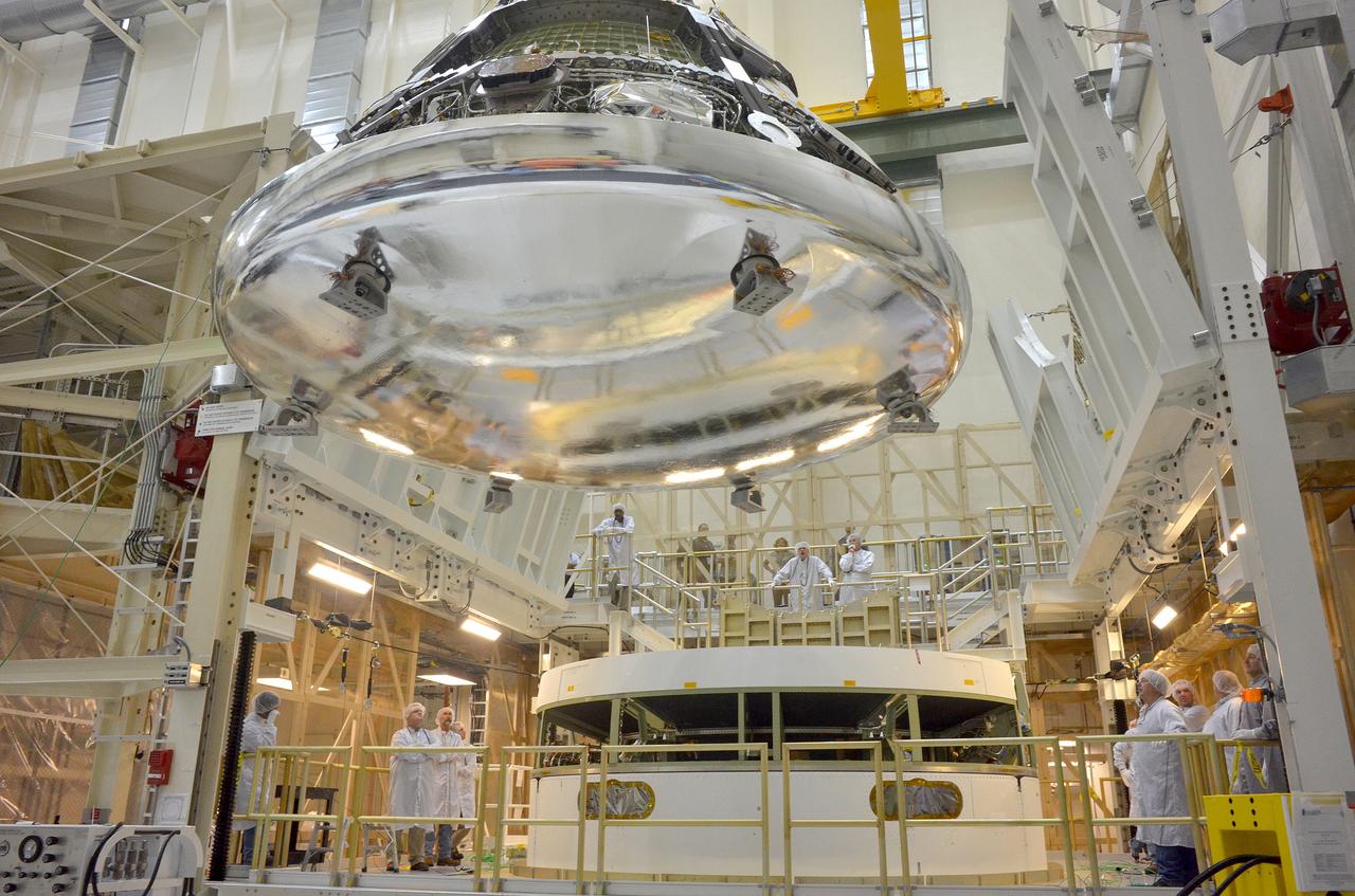  The Orion Exploration Flight Test-1 (EFT-1) crew module is moved and mated with the service module at the Operations and Checkout (O&amp;C) Building at Kennedy Space Center on June 9, 2014. Part of Batch image transfer from Flickr.