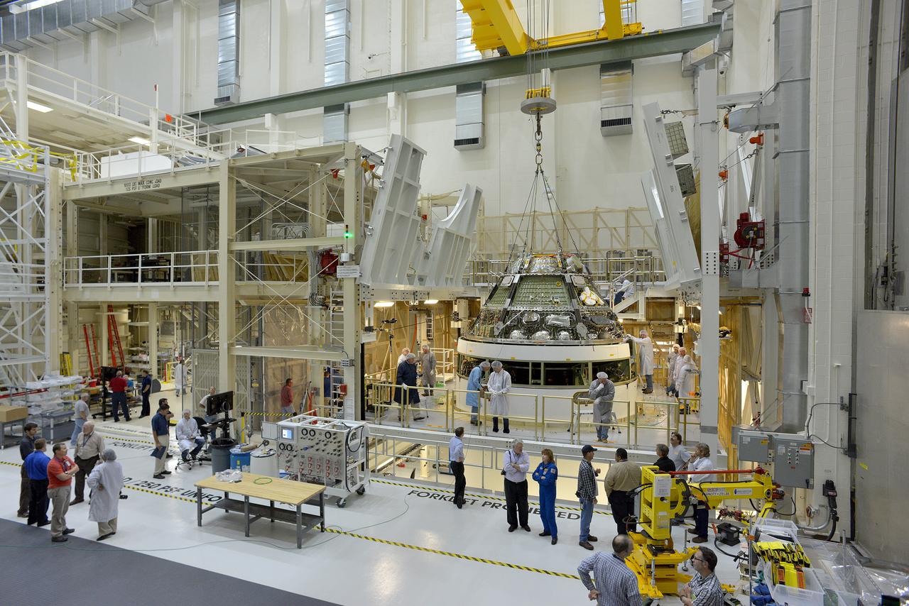  The Orion Exploration Flight Test-1 (EFT-1) crew module is moved and mated with the service module at the Operations and Checkout (O&amp;C) Building at Kennedy Space Center on June 9, 2014. Part of Batch image transfer from Flickr.