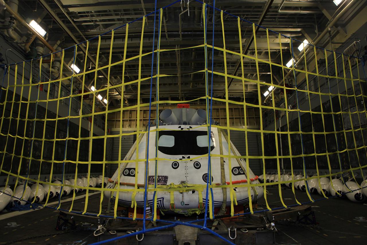 A test version of Orion waits inside of the well deck of the U.S.S. Anchorage on July 31, 2014. A combined NASA and U.S. Navy team practiced recovery techniques off the coast of Californiain preparation for Exploration Flight Test-1 (EFT-1). Part of Batch image transfer from Flickr.
