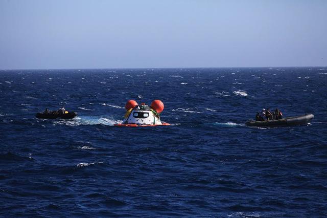 Orion recovery training and operations continue in the Pacific Ocean on Sept. 14, 2014. NASA and the Navy team on board the USS Salvor are evaluating procedures for pulling a test version of the spacecraft out of the ocean using the ship's crane.  Part of Batch image transfer from Flickr.