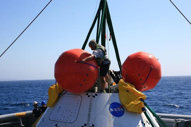Orion recovery training and operations continue in the Pacific Ocean on Sept. 14, 2014. NASA and the Navy team on board the USS Salvor are evaluating procedures for pulling a test version of the spacecraft out of the ocean using the ship's crane.  Part of Batch image transfer from Flickr.
