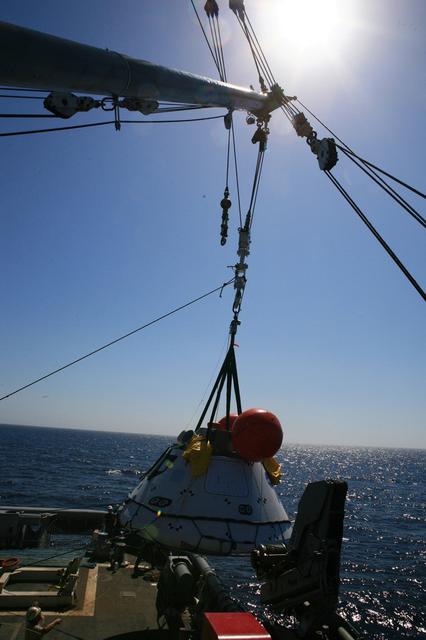 Orion recovery training and operations continue in the Pacific Ocean on Sept. 14, 2014. NASA and the Navy team on board the USS Salvor are evaluating procedures for pulling a test version of the spacecraft out of the ocean using the ship's crane.  Part of Batch image transfer from Flickr.