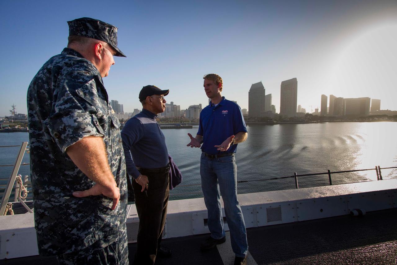 NASA Administrator Charles Bolden talks with a member of the Orion recovery team on board the USS Anchorage as the ship heads to sea to test Orion recovery tools and techniques on Sept. 15, 2014, prior to Exploration Flight Test-1 (EFT-1). Part of Batch image transfer from Flickr.