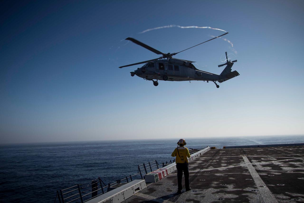 On Sept. 15, 2014, a helicopter used to gather photos and video lands on the flight deck of the USS Anchorage, which is being used to try out Orion recovery techniques in the Pacific Ocean, prior to Exploration Flight Test-1 (EFT-1).  Part of Batch image transfer from Flickr.