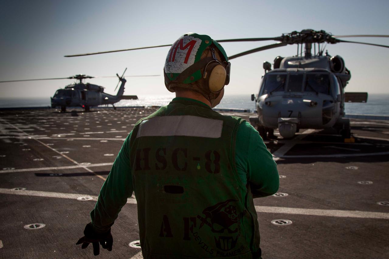 On Sept. 15, 2014, helicopters used to gather photos and video touchdown on the flight deck of the USS Anchorage, which is being used to try out Orion recovery techniques in the Pacific Ocean, prior to Exploration Flight Test-1 (EFT-1).  Part of Batch image transfer from Flickr.