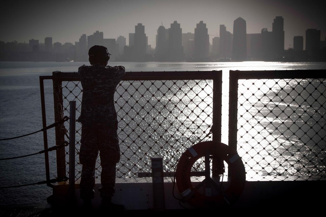 The San Diego skyline grows distant in the background as the USS Anchorage leaves port on Sept. 15, 2014 to begin testing Orion recovery tools and techniques prior to Exploration Flight Test-1 (EFT-1).  Part of Batch image transfer from Flickr.