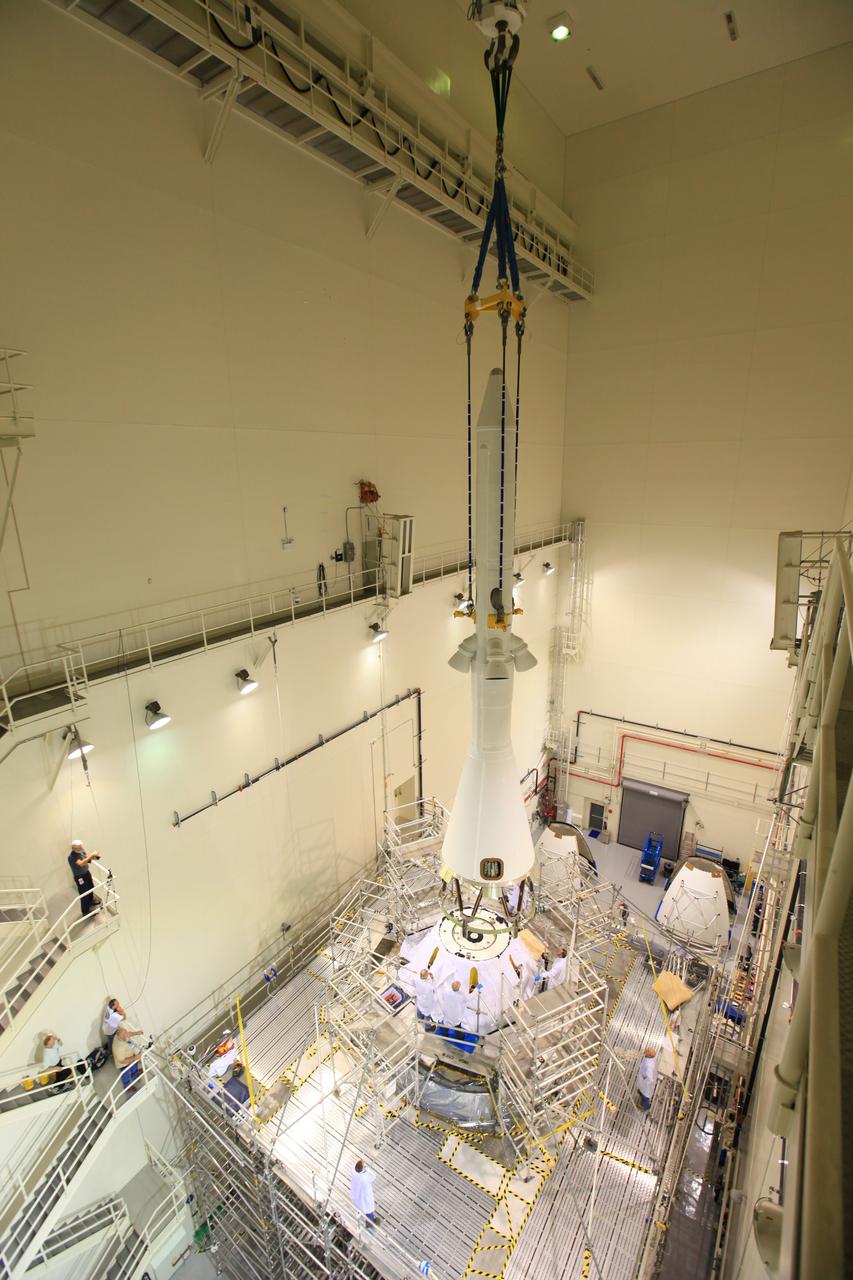 Exploration Flight Test-1 (EFT-1) Orion's launch abort system, or LAS, is positioned atop the crew and service module in the Launch Abort System Facility (LASF) at Kennedy Space Center on Oct. 3, 2014, in preparation for rollout to mate with the Delta IV Heavy launch vehicle. The LAS is designed to activate within milliseconds to pull the crew module to safety in case of an emergency. Exploration Flight Test-1 (EFT-1) verified the function of the jettison motor to separate the LAS from the crew module to ensure a safe, successful mission.   Part of Batch image transfer from Flickr.