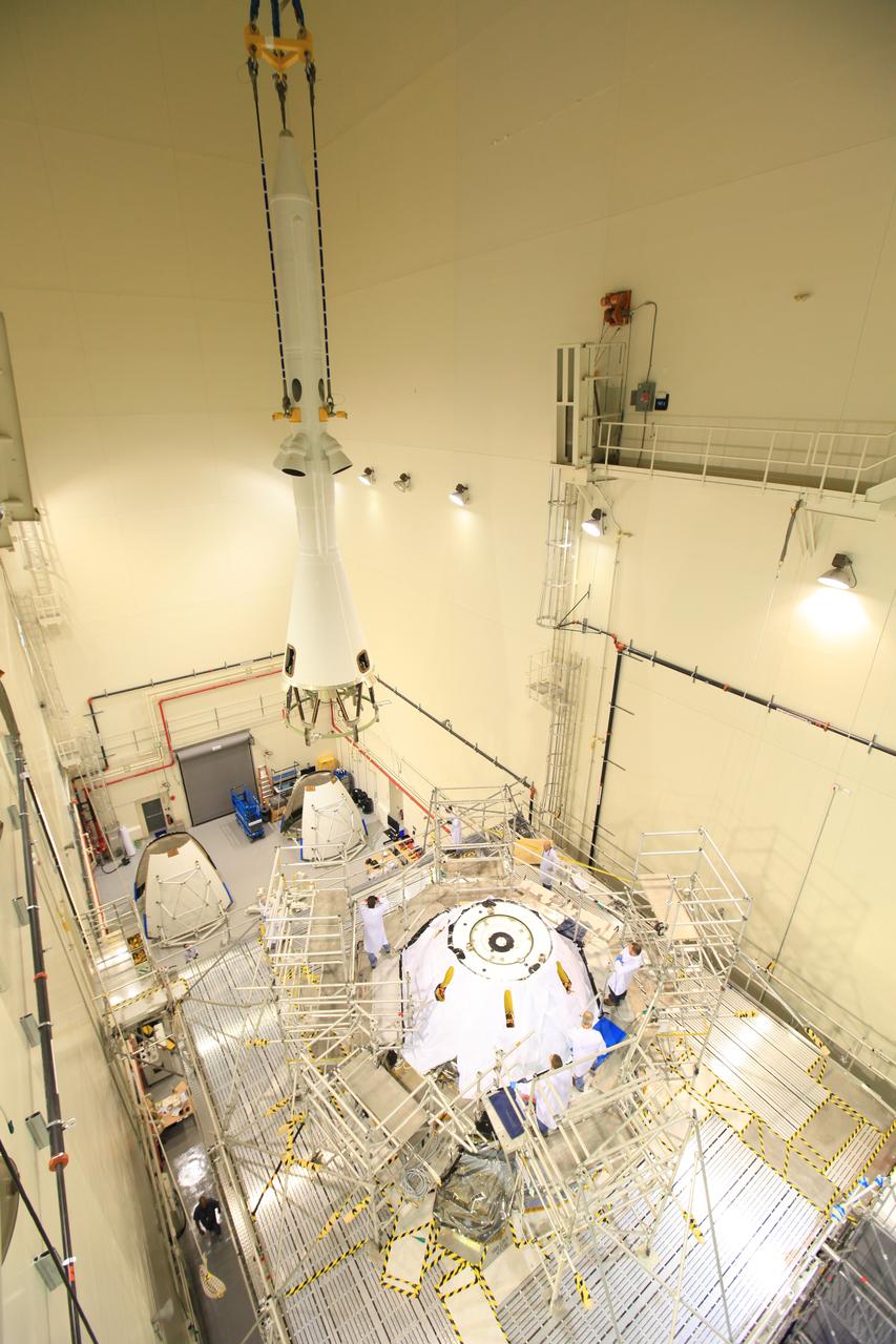 Exploration Flight Test-1 (EFT-1) Orion's launch abort system, or LAS, is positioned atop the crew and service module in the Launch Abort System Facility (LASF) at Kennedy Space Center on Oct. 3, 2014, in preparation for rollout to mate with the Delta IV Heavy launch vehicle. The LAS is designed to activate within milliseconds to pull the crew module to safety in case of an emergency. Exploration Flight Test-1 (EFT-1) verified the function of the jettison motor to separate the LAS from the crew module to ensure a safe, successful mission.  Part of Batch image transfer from Flickr.