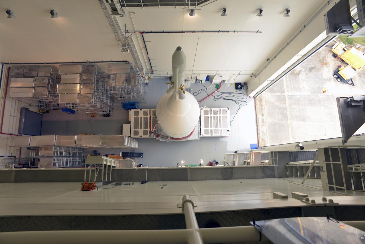 The Orion for Exploration Flight Test-1 (EFT-1) is stacked and ready to roll to the pad in the Launch Abort System Facility (LASF) at Kennedy Space Center on Nov. 10, 2014. The Orion stack, consisting of the launch abort system, the crew module, and the service module measures over 80 feet tall.  Part of Batch image transfer from Flickr.