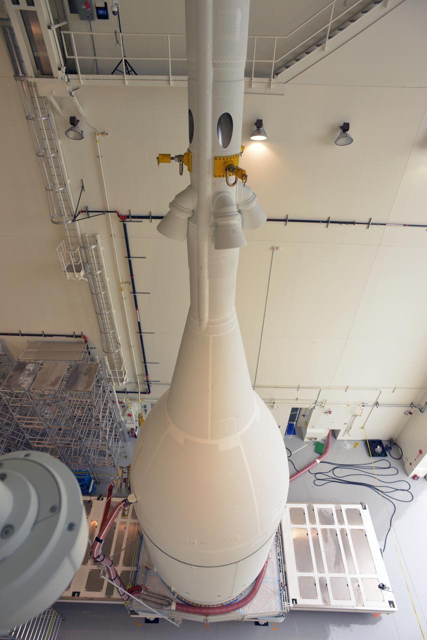 The Orion for Exploration Flight Test-1 (EFT-1) is stacked and ready to roll to the pad in the Launch Abort System Facility (LASF) at Kennedy Space Center on Nov. 10, 2014. The Orion stack, consisting of the launch abort system, the crew module, and the service module measures over 80 feet tall.  Part of Batch image transfer from Flickr.