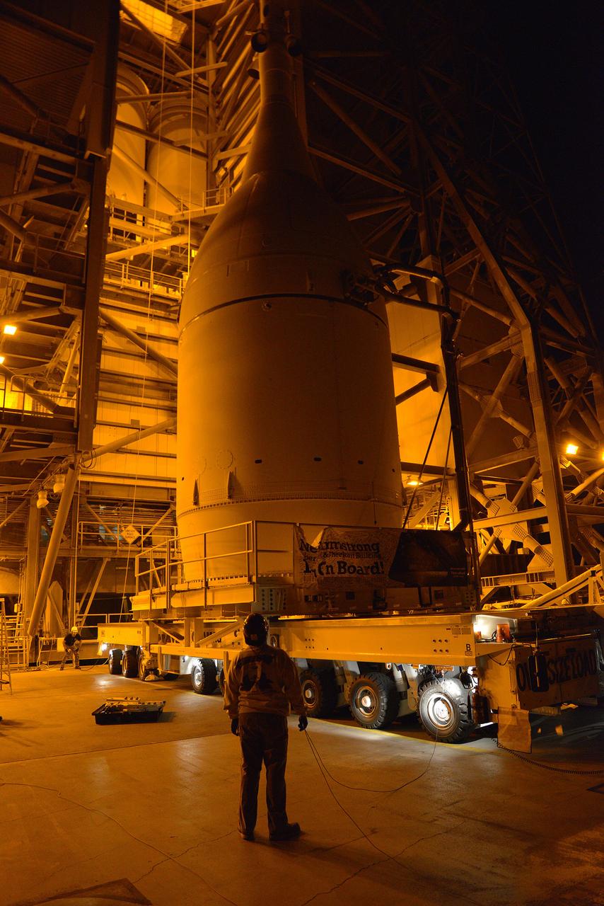 Engineers and technicians at Space Launch Complex 37 move Orion into place in the service structure so the spacecraft can be lifted and joined to the top of the Delta IV Heavy rocket on Nov. 12, 2014.  Part of Batch image transfer from Flickr.