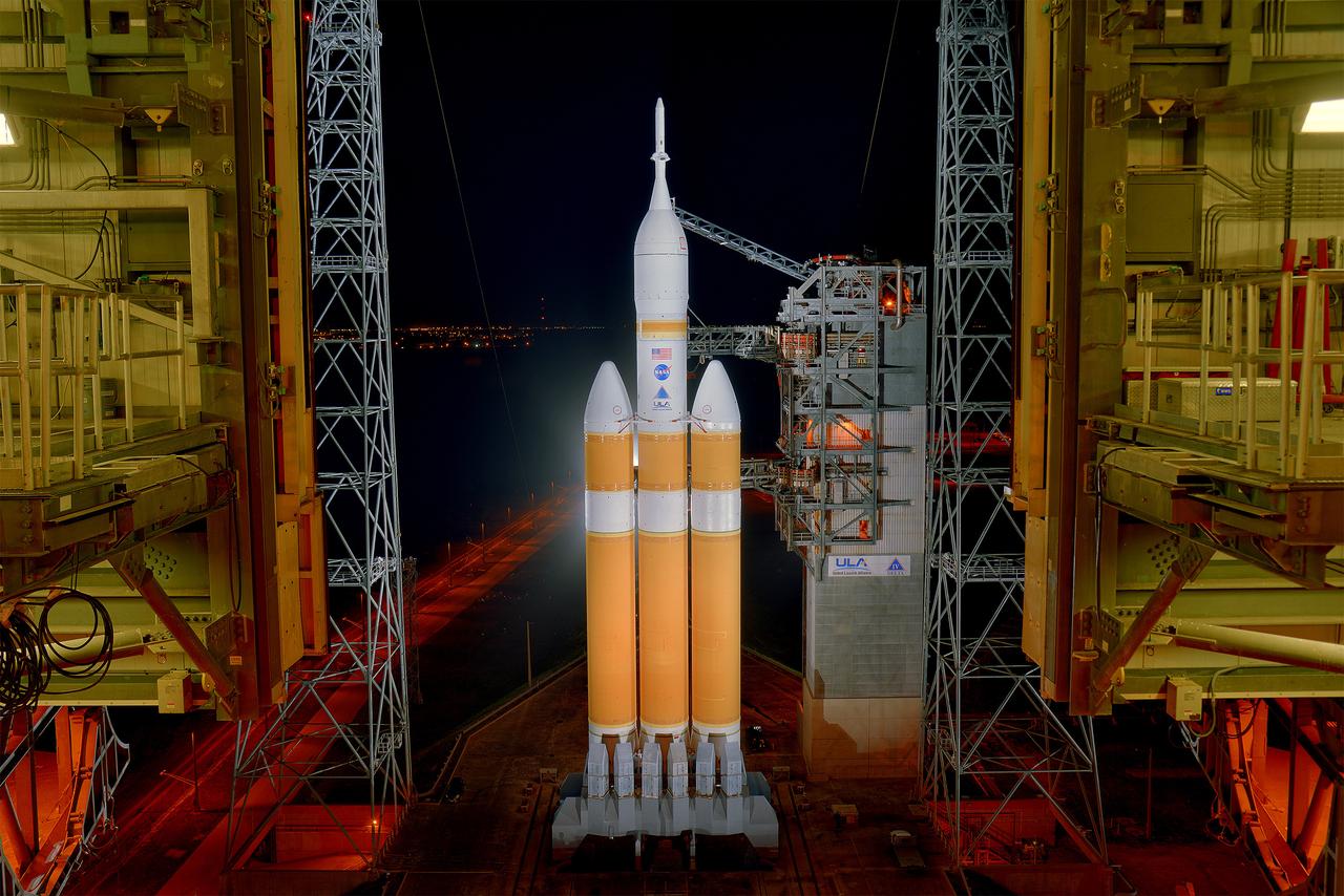 The launch gantry is rolled back to reveal NASA's Orion spacecraft mounted atop a United Launch Alliance Delta IV Heavy rocket at Cape Canaveral Air Force Station's Space Launch Complex 37 on Dec. 3, 2014.  Part of Batch image transfer from Flickr.