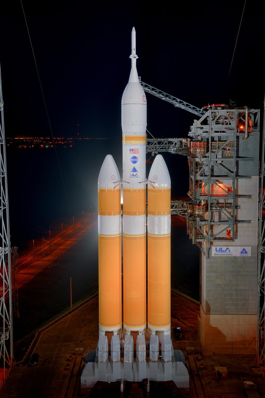 The launch gantry is rolled back to reveal NASA's Orion spacecraft mounted atop a United Launch Alliance Delta IV Heavy rocket at Cape Canaveral Air Force Station's Space Launch Complex 37 on Dec. 3, 2014.  Part of Batch image transfer from Flickr.
