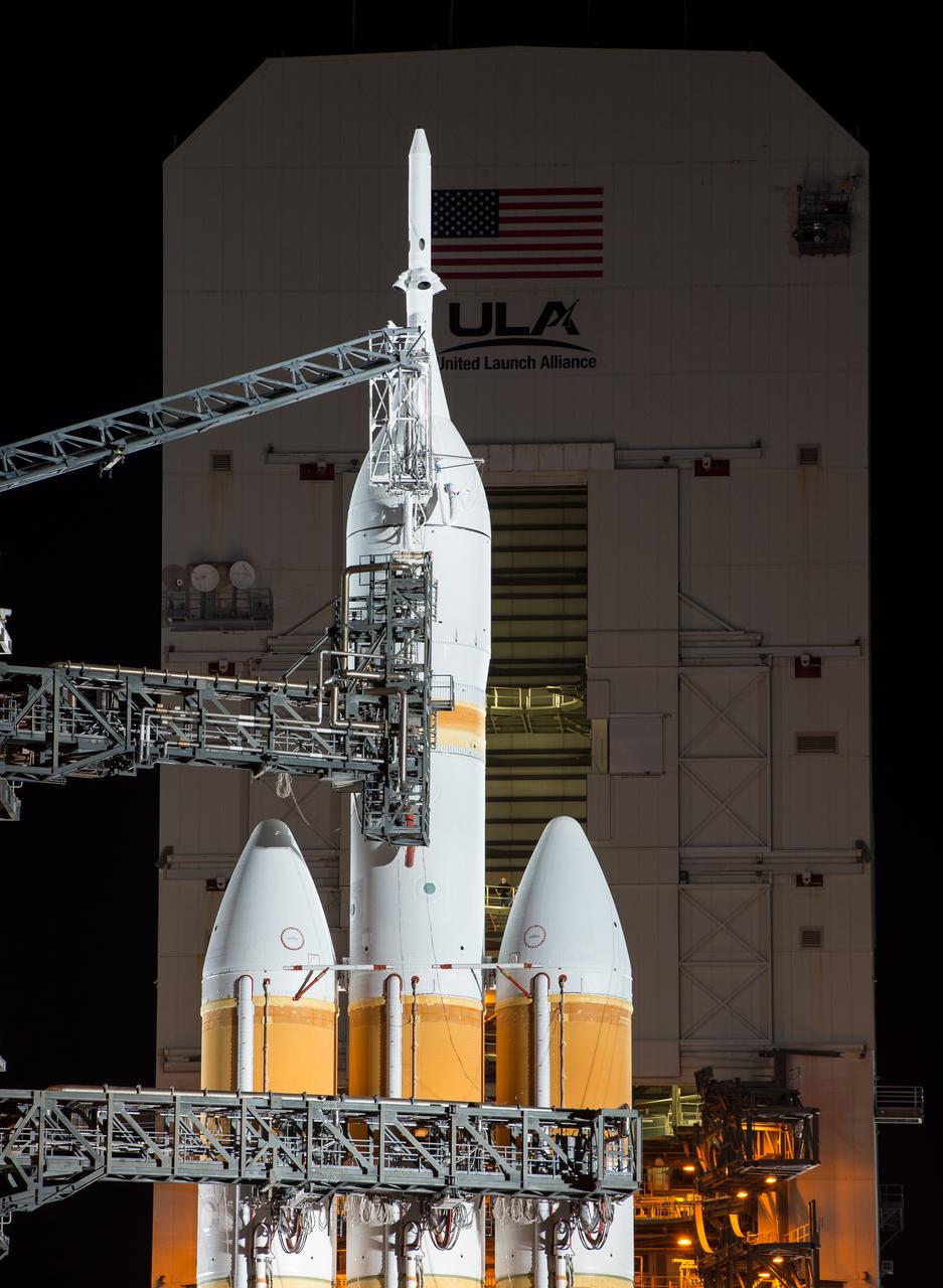 A United Launch Alliance Delta IV Heavy rocket with NASA’s Orion spacecraft mounted atop for Exploration Flight Test-1 (EFT-1) is seen after the Mobile Service Tower was finished rolling back early on Dec. 4, 2014, at Cape Canaveral Air Force Station's Space Launch Complex 37, Florida. Part of Batch image transfer from Flickr.
