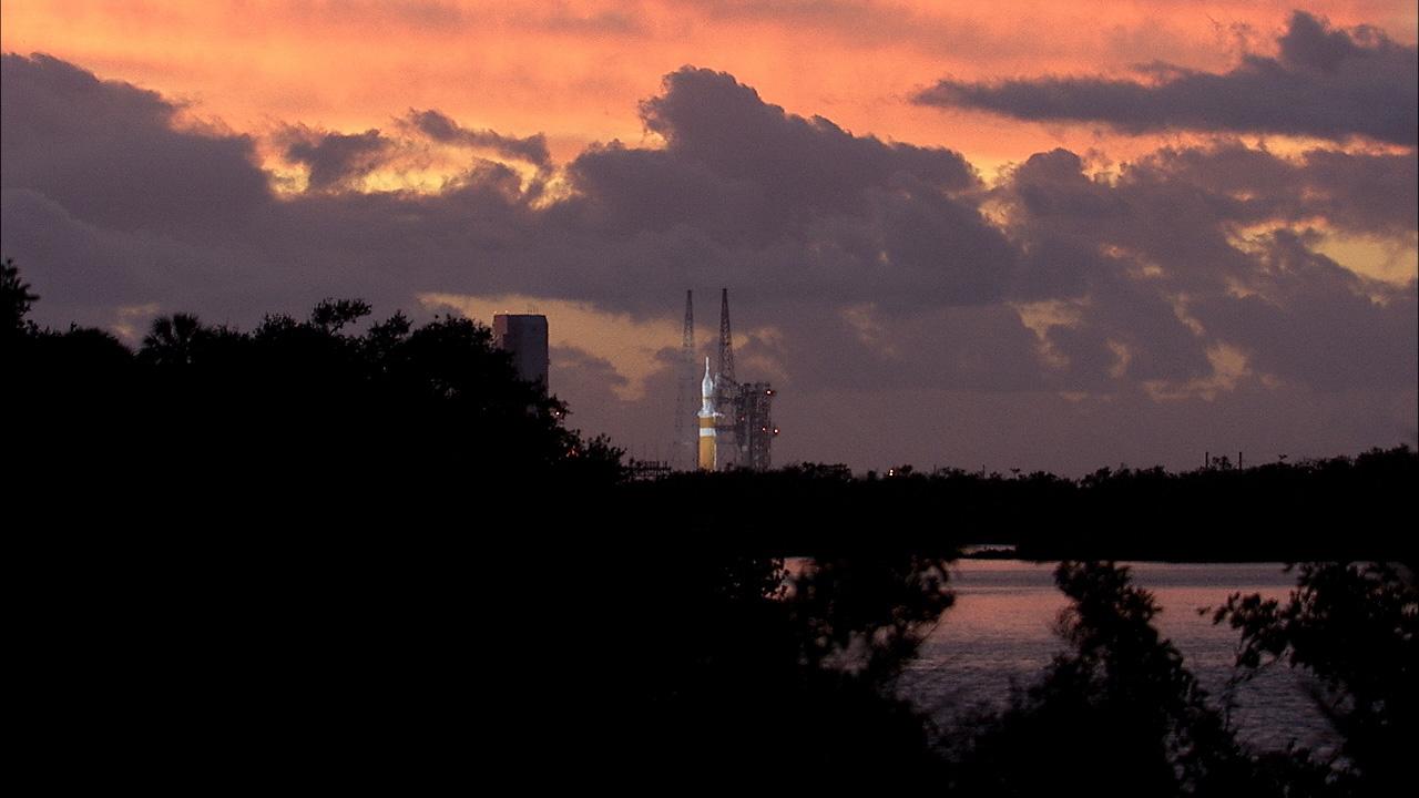 A spectacular sunrise at NASA's Kennedy Space Center in Florida heralds the arrival of a new era in exploration as the countdown continues for the launch of a United Launch Alliance Delta IV Heavy topped by the agency's Orion spacecraft for its first flight test on Exploration Flight Test-1 (EFT-1) on Dec. 4, 2014. Part of Batch image transfer from Flickr.