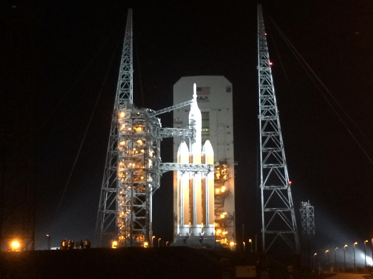 The launch gantry is rolled back to reveal NASA's Orion spacecraft mounted atop a United Launch Alliance Delta IV Heavy rocket ready for Exploration Flight Test-1 (EFT-1) at Cape Canaveral Air Force Station's Space Launch Complex 37 on Dec. 4, 2014. Part of Batch image transfer from Flickr.
