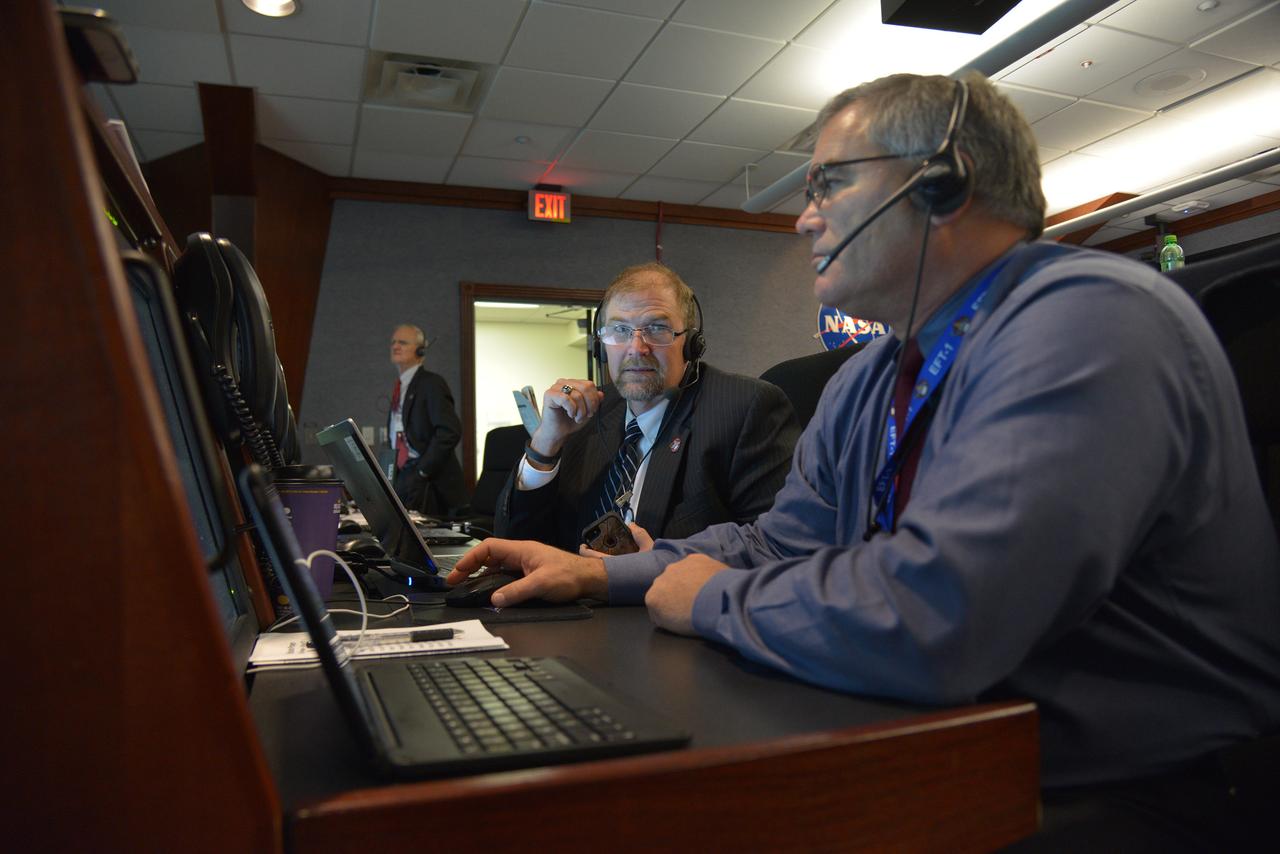 The Orion team reviews the launch procedure in Building AE at Cape Canaveral Air Force Stationahead of the launch of Orion on Exploration Flight Test-1 (EFT-1) on Dec. 4, 2014.  Part of Batch image transfer from Flickr.