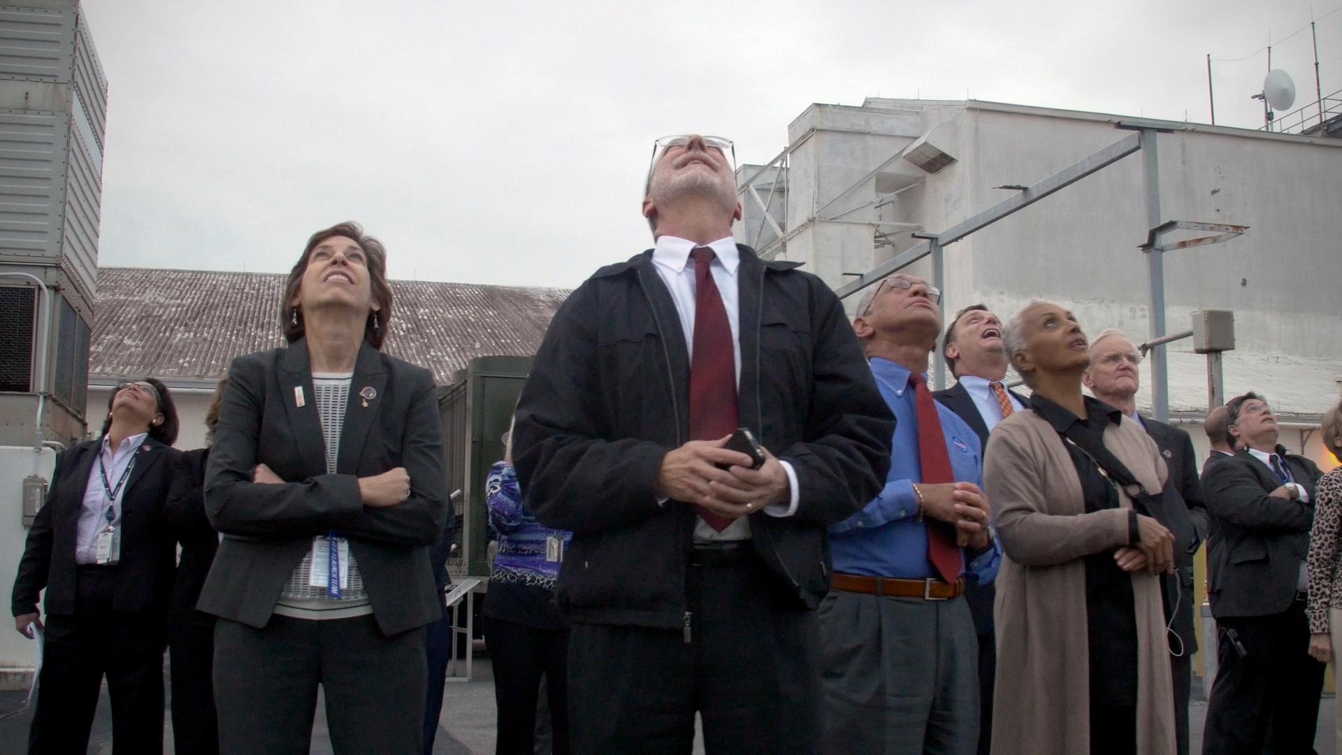 NASA and Lockheed Martin leadership team watching the Exploration Flight Test-1 launch outside of Hanger AE at Cape Canaveral Air Force Station in Florida